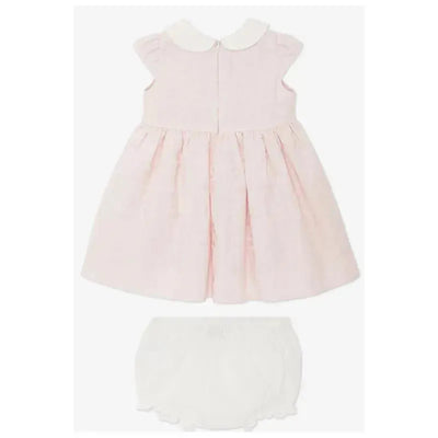 Cotton jacquard baby dress in pink with a white collar, paired with matching white shorts.