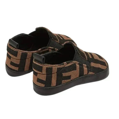 Slip-on crib shoes for babies featuring a brown and black Fendi logo pattern, designed for comfort and style.