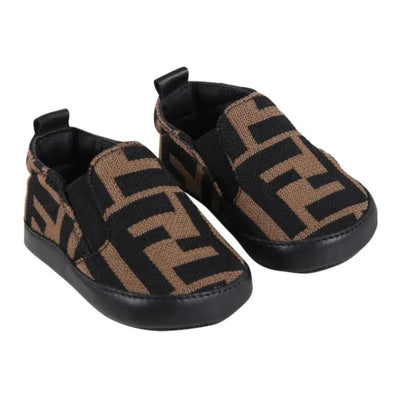 Neutral Fendi Baby Slip On Crib Shoes featuring a black and brown FF logo pattern and soft, flexible soles.