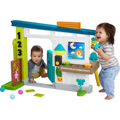 Fisher Price Laugh & Learn Ultimate Playhouse, featuring two toddlers engaging with interactive elements and colorful shapes.