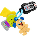 Colorful toy keys including a smiling puppy character and a remote with ABC and 123 buttons, designed for baby play.