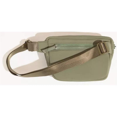 Sage green neoprene play pack with a zippered compartment and adjustable strap.