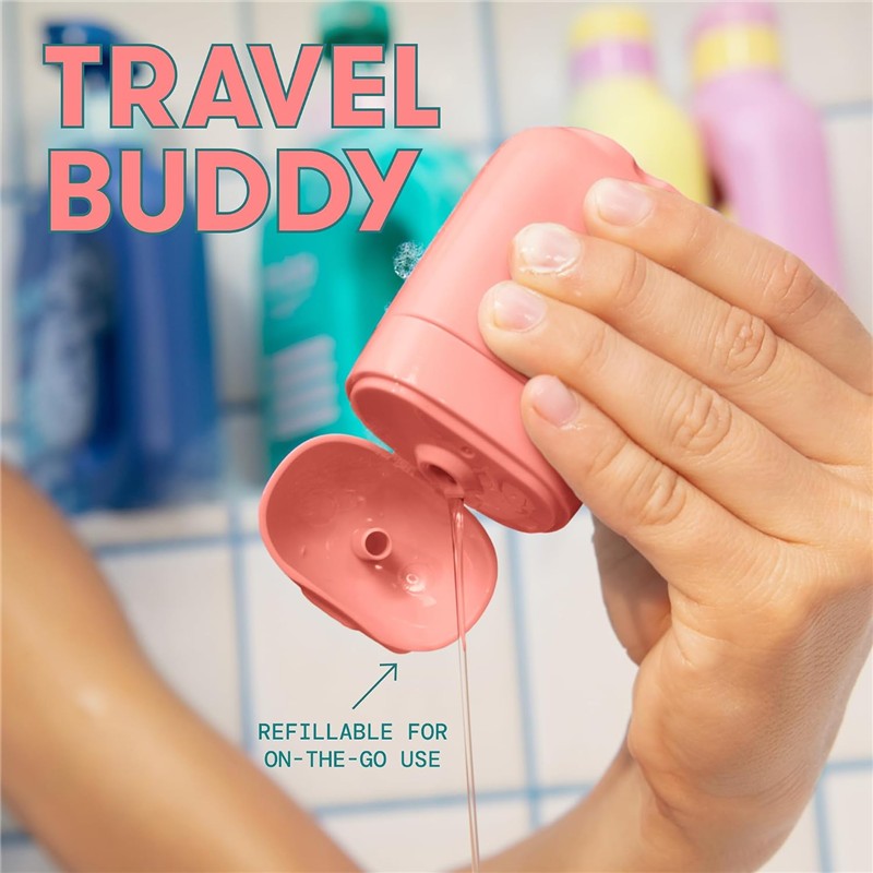 Frida for Kids Body Wash in a pink travel container is being poured, showcasing its refillable feature for convenience.