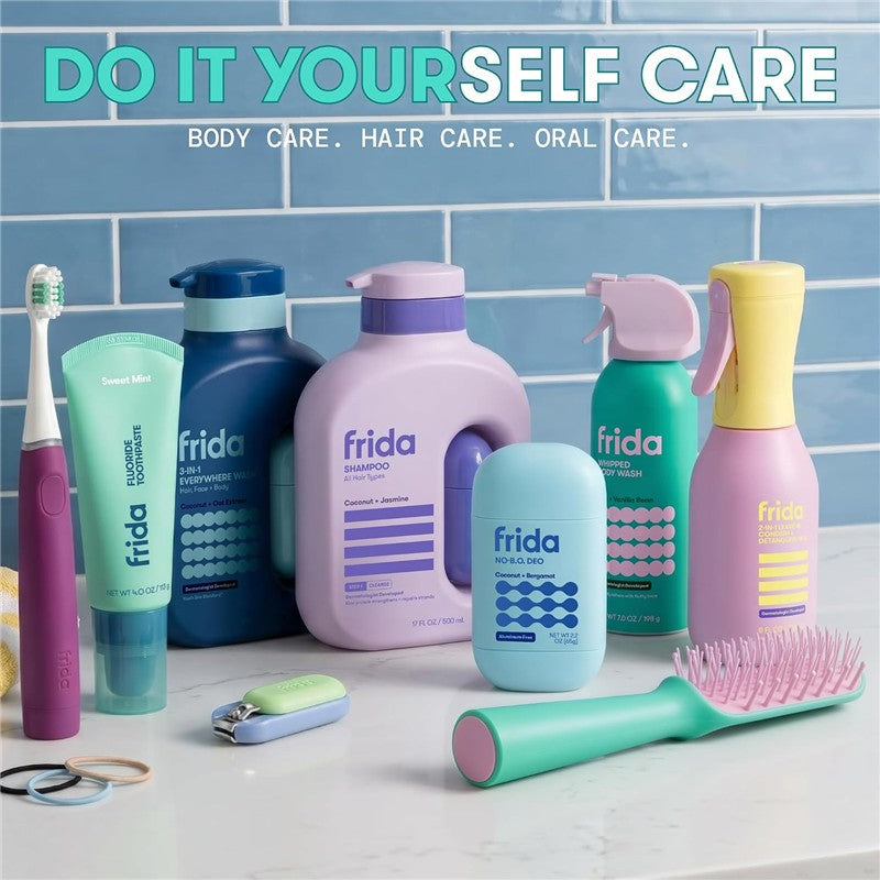 Frida for Kids Whipped Body Wash, 7 oz, alongside various Frida personal care products arranged on a countertop.