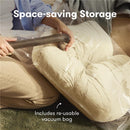 Frida Mom Compact Support 4-in-1 Cooling Pregnancy Pillow being vacuum sealed in a clear bag, showing a re-usable vacuum bag.