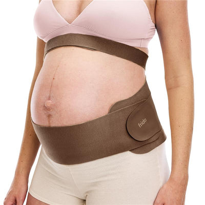 Dual support belly band for pregnancy in cocoa color, worn around a pregnant belly, offering support and comfort.