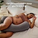 Gray Frida Mom Pregnancy Body Pillow supports a pregnant woman sleeping comfortably in bed, highlighted by promotional text.