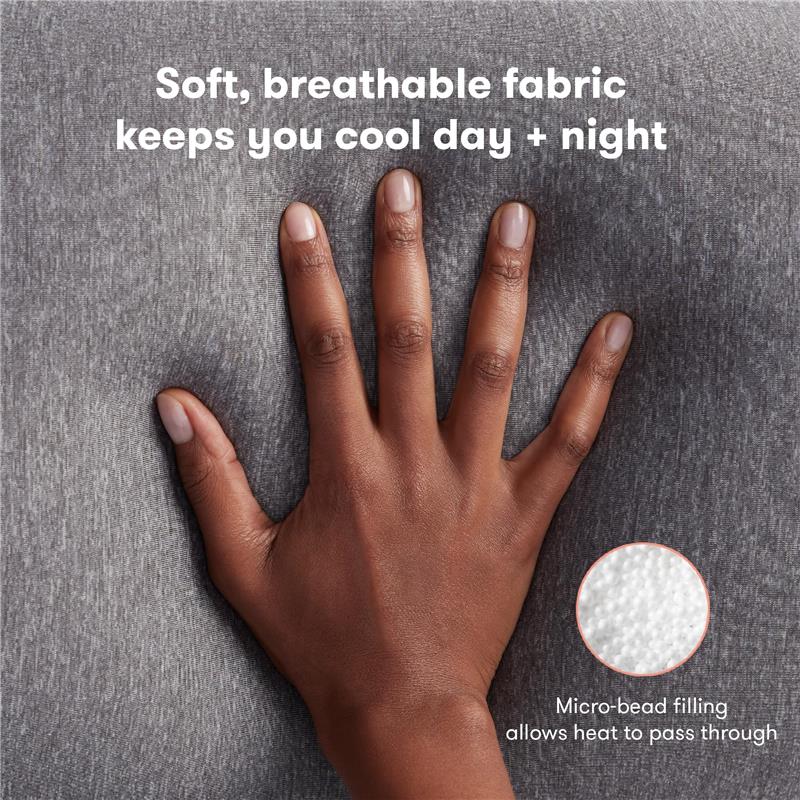 Soft, breathable gray fabric of Frida Mom Pregnancy Body Pillow, hand resting on it with text highlighting cooling features and micro-bead filling.