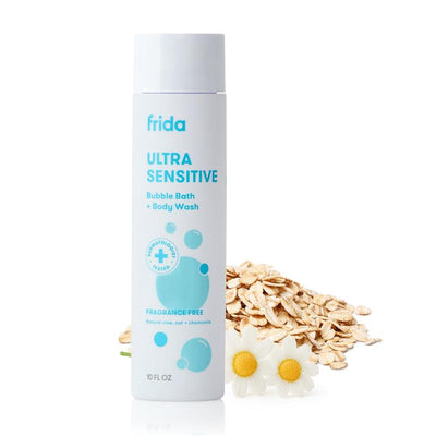 Fridababy Ultra Sensitive Unscented Bubble Bath + Body Wash, 10oz, with oat and chamomile, alongside oats and flowers.