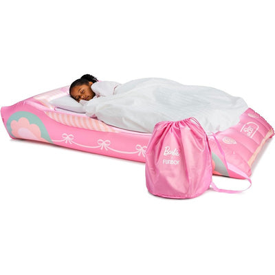 Kids air mattress featuring a pink Barbie design, with a child sleeping under a white blanket beside a storage bag.