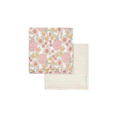 Muslin blanket set featuring one floral design in pink and yellow, and one plain light beige blanket.