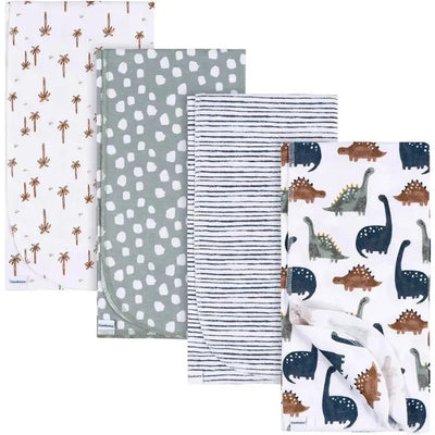 Four flannel blankets from the Gerber Bedding Dino Time set, featuring dinosaur prints and various patterns suitable for boys.