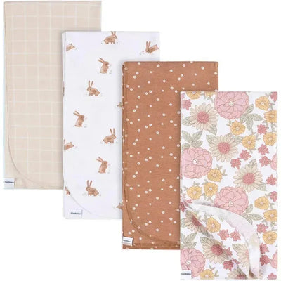 Four flannel bedding pieces by Gerber featuring retro floral and bunny designs, suitable for girls.