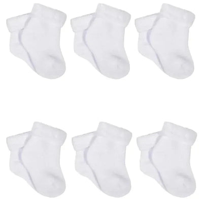Six pairs of white terry wiggle-proof socks for infants, featuring a soft, cozy design with a cuffed top.