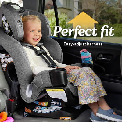 Graco 4Ever DLX 4-in-1 car seat with a child securely harnessed, featuring a grey design and visible easy-adjust harness label.