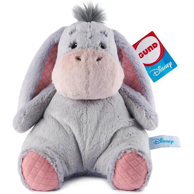 Oh So Snuggly Eeyore plush toy with gray fur, pink accents, and Disney tag, featuring large floppy ears and a tufted mane.