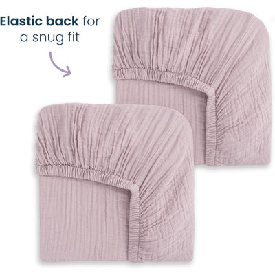 Full-size fitted crib sheets in mauve with elastic backs for a snug fit, displayed in a 2-pack.