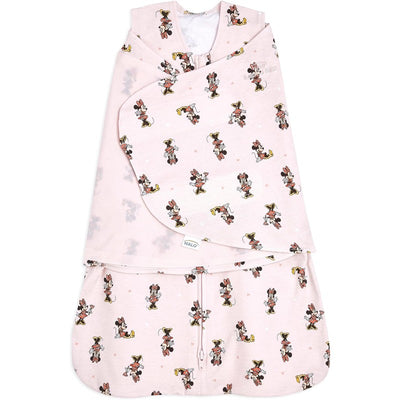 HALO SleepSack Swaddle in pink cotton features repeating Minnie Mouse designs and a 1.5 TOG rating for comfortable sleeping.