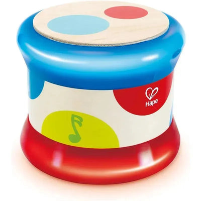 Colorful Hape Baby Drum with a blue top, decorated with red and blue dots, and a music note design on the side.
