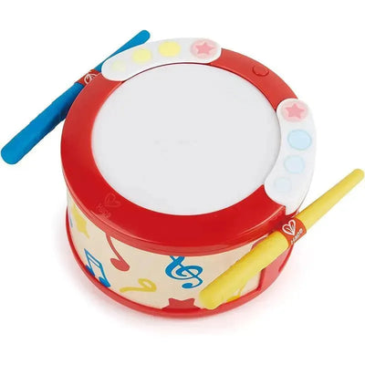 Hape Electronic Kids Drum in red, featuring colorful musical notes, lights, and two drumsticks for guided play.