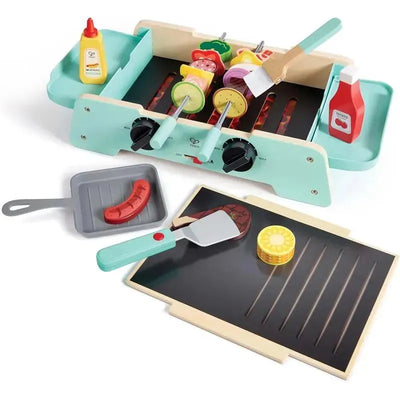 Hape Sizzling Griddle & Grill BBQ playset with colorful food pieces, cooking utensils, and adjustable knobs.