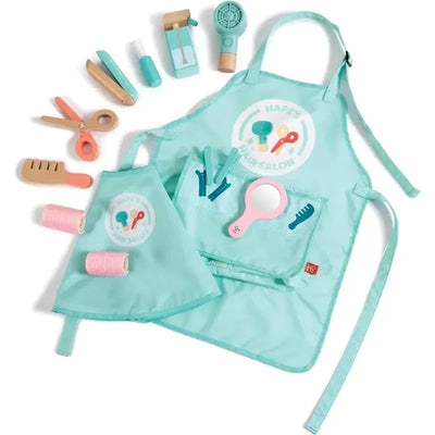 Hape Super Stylish Hair Salon Set, featuring a turquoise apron, hair accessories, scissors, hair dryer, and a mirror.