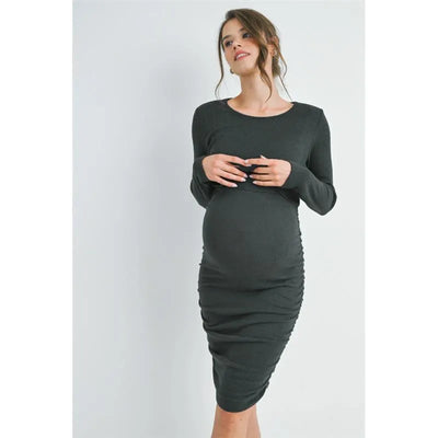 Double layer ruched nursing dress in dark green, worn by a smiling woman showcasing its fitted design and long sleeves.