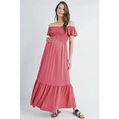 Off-the-shoulder dark rose maternity maxi dress with ruffled sleeves, worn by a model, highlighting comfort and style.