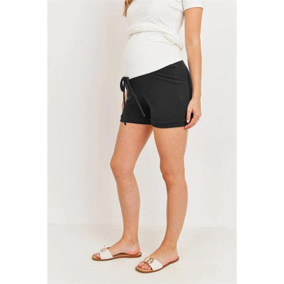 Solid black maternity track shorts featuring an over-the-belly design, styled with a side drawstring.