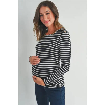 Black and white striped long sleeve maternity top worn by a pregnant woman, featuring button trim and a fitted shape.