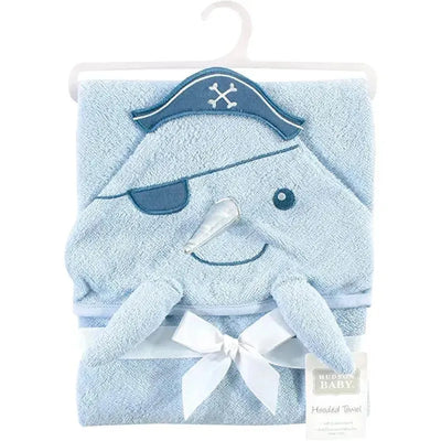 Hooded towel shaped like a narwhal, featuring a pirate hat, eyepatch, and a bow, designed for babies.