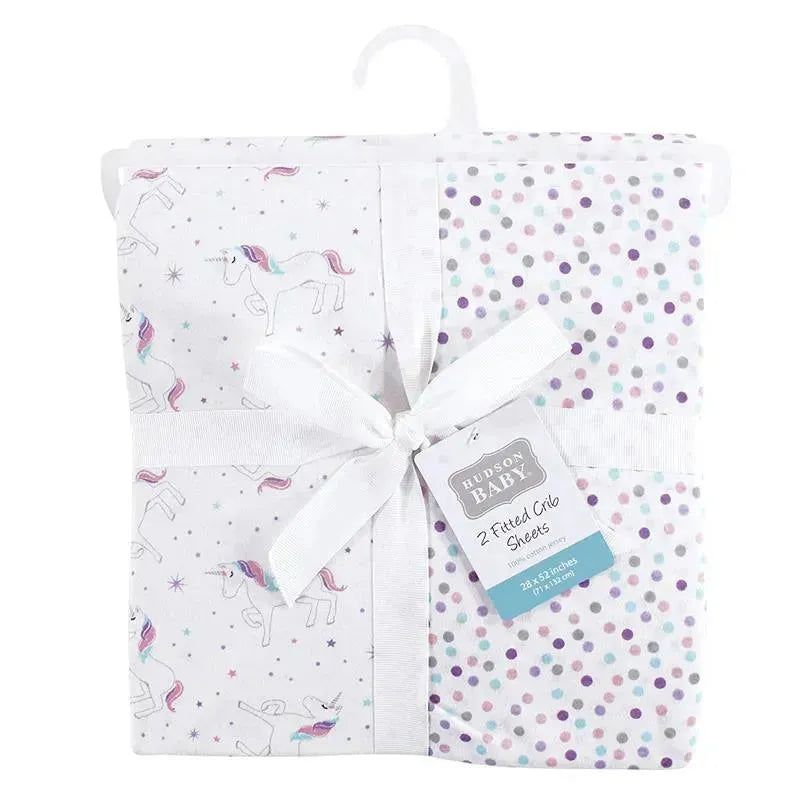 Unisex baby cotton fitted crib sheets featuring unicorn and polka dot designs, packaged with a ribbon.