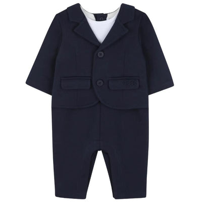 Navy blue suit-style romper for boys with a blazer and matching pants, featuring front buttons and two pockets.