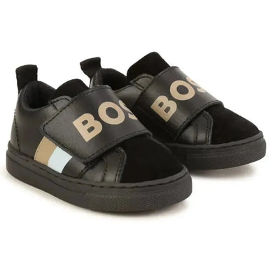 Boys black Velcro trainers by Hugo Boss with logo, featuring black leather and suede, and decorative blue and beige stripes.