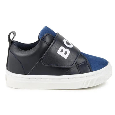 Navy blue Hugo Boss Baby sneakers featuring a white elastic logo strap and a white rubber sole.
