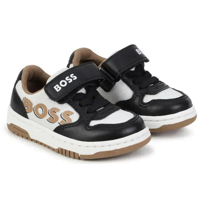 Black and beige Hugo Boss trainers for boys with a Velcro strap and logo detailing.