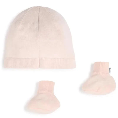 Knit hat and booties set in soft pink by Hugo Boss, featuring a ribbed design and brand tag on the booties.