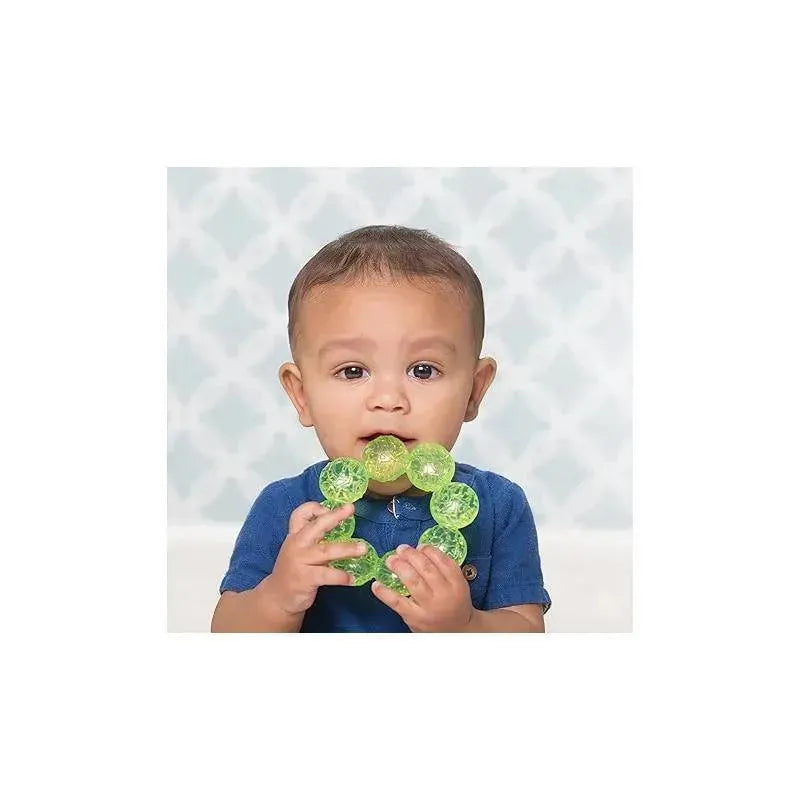 A child holds colorful Infantino water teething toys, featuring pink and lime green circular beads, with an engaging expression.