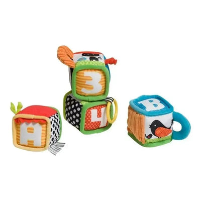 Soft fabric blocks in vibrant colors, featuring numbers and letters, designed for infant play and learning.