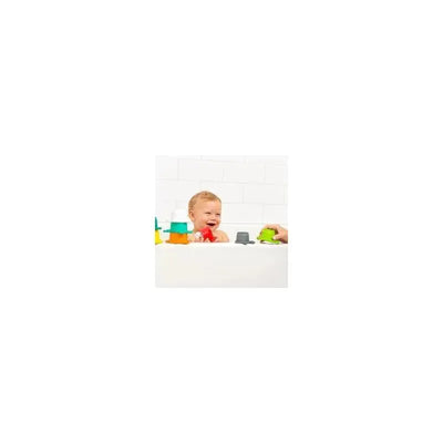 Baby playing happily in a bathtub with colorful stacking cups from the Infantino Splish & Splash Bath Play Set.