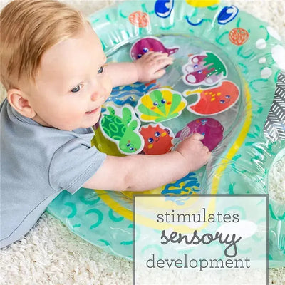 Baby playing with the Infantino Wwo Pat & Play Water Mat featuring colorful aquatic characters, promoting sensory development.