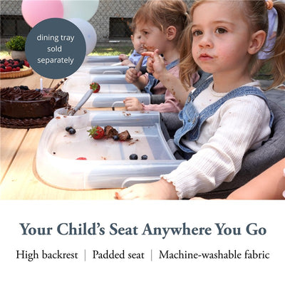Inglesina Fast Table Chair in Stone Gray Melange with children using it at a party, featuring clear trays and snacks.