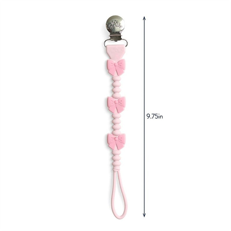 Pink silicone pacifier clip featuring three bows, measuring 9.75 inches long, with a metal clip for attachment.