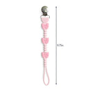 Pink silicone pacifier clip featuring three bows, measuring 9.75 inches long, with a metal clip for attachment.