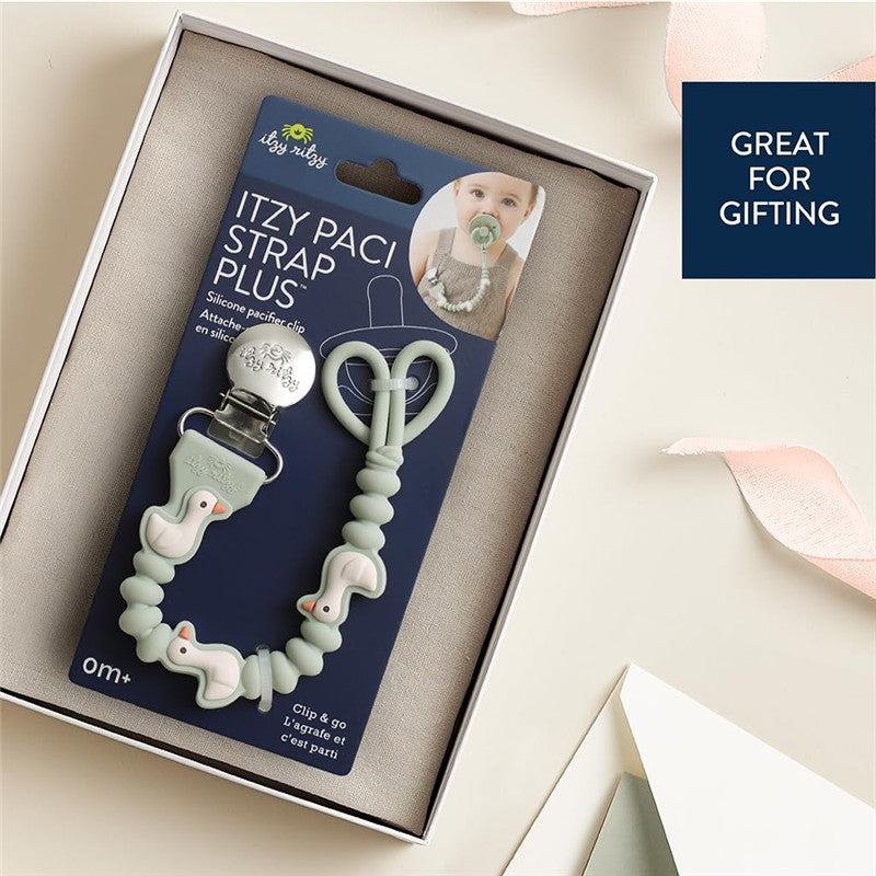 Itzy Ritzy Itzy Paci Strap Plus in mint green, featuring a silicone pacifier clip with a duck design, ideal for gifting.