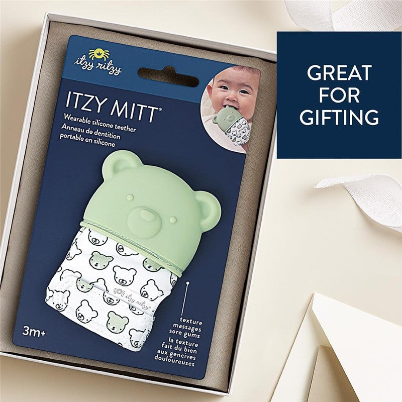 Wearable silicone teether in bear shape, features textured fabric for soothing gums, packaged for gifting, suitable for ages 3 months and up.