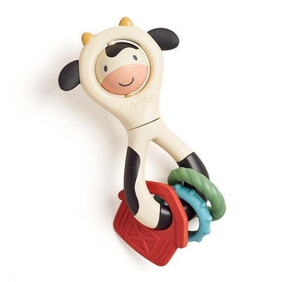 Spinner rattle shaped like a cow with a smiling face, featuring colorful rings for sensory play and teething.