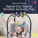 Itzy Ritzy Spiral Car Seat & Stroller Activity Toy hangs above a smiling baby in a car seat, featuring colorful plush toys and rings.