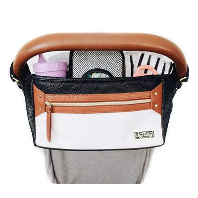Stroller caddy in coffee and cream colors with various compartments for drinks and accessories, designed for parents on-the-go.