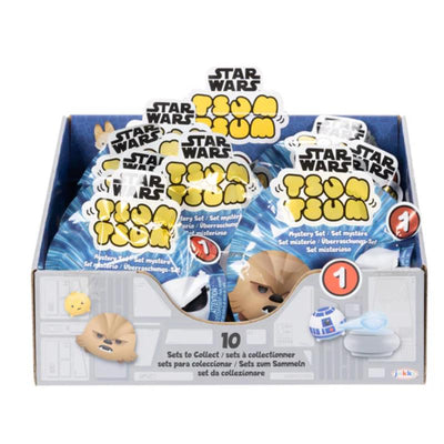Star Wars Tsum Tsum blind bag display featuring mystery sets. Includes Chewbacca and R2-D2 designs.